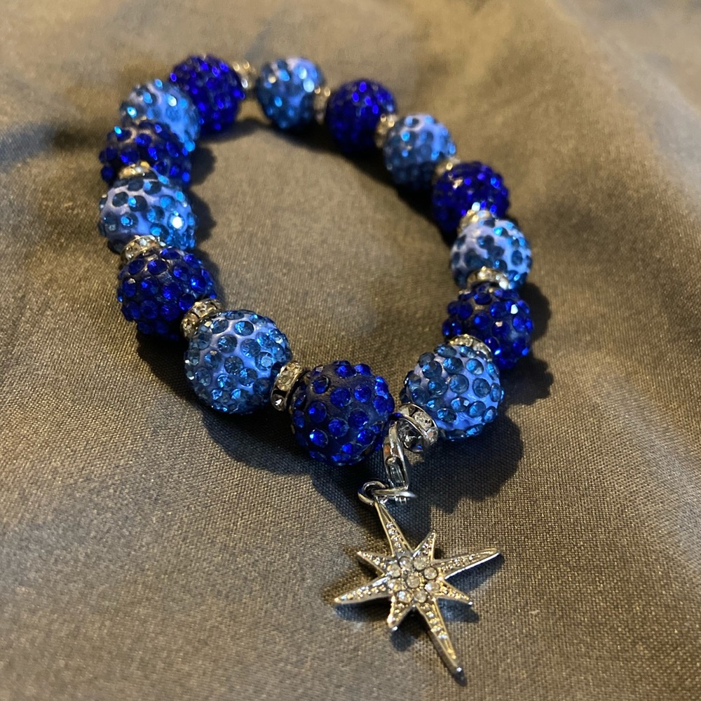 Blue sparkly stretch bracelet with snowflake charm